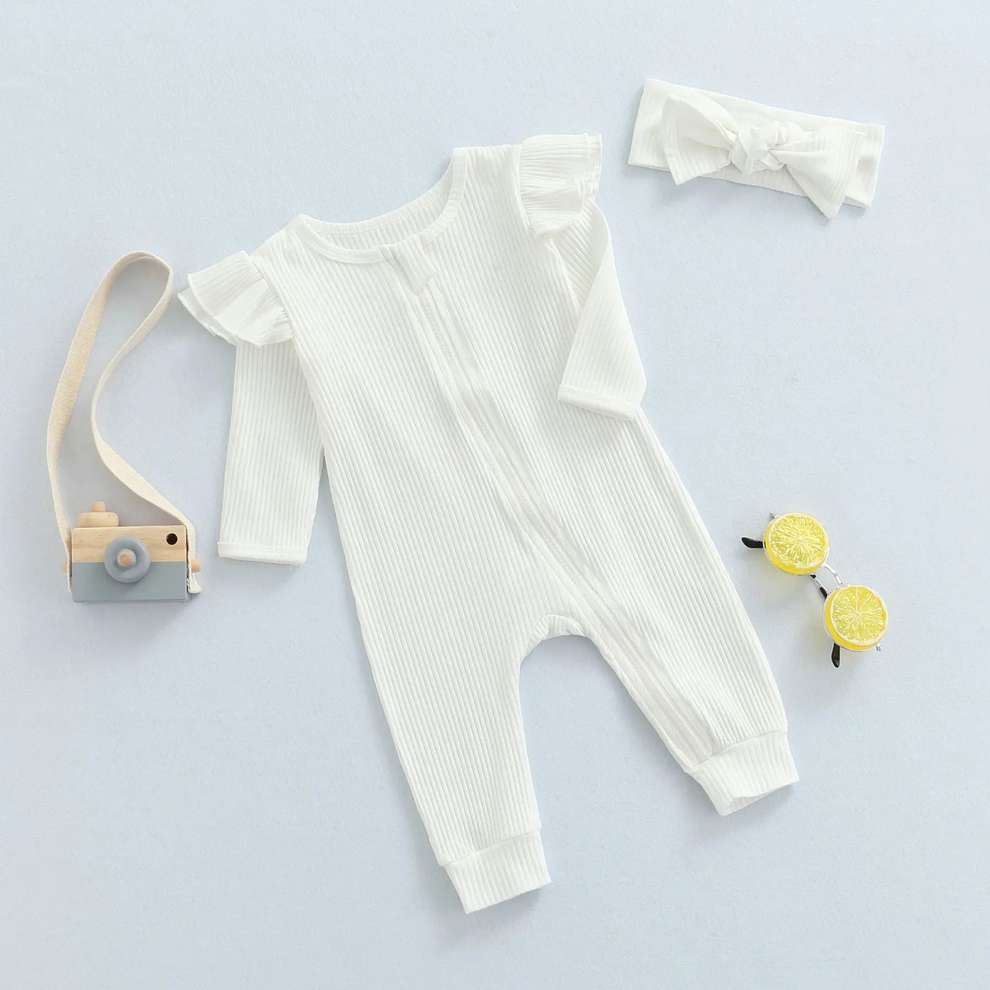 RIBBED RUFFLE ARM ROMPER